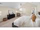 Bright main bedroom with vaulted ceilings, a ceiling fan, and a sitting area at 2434 S Williams St, Denver, CO 80210
