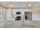 Modern kitchen with stainless steel appliances, white cabinetry, and a marble countertop island at 13732 E Lehigh Ave # H, Aurora, CO 80014