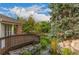 Scenic view of a community pond with lush landscaping and a wooden bridge at 13732 E Lehigh Ave # H, Aurora, CO 80014