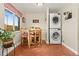 Cozy breakfast nook with wooden table, chairs, and convenient laundry area at 1432 Xanthia St, Denver, CO 80220