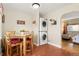 Bright nook featuring a wooden table, chairs, and laundry setup at 1432 Xanthia St, Denver, CO 80220