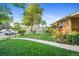 Well-manicured front yard featuring lush lawn and established landscaping at 1432 Xanthia St, Denver, CO 80220