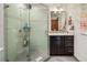 Bathroom featuring a glass shower and marble vanity at 1654 Muirfield Ln, Evergreen, CO 80439