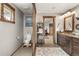 Bathroom with toilet, vanity, and view to bedroom at 1654 Muirfield Ln, Evergreen, CO 80439