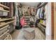Walk-in closet with custom shelving and storage at 1654 Muirfield Ln, Evergreen, CO 80439