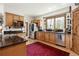 Kitchen with granite countertops, stainless steel appliances, and hardwood floors at 1654 Muirfield Ln, Evergreen, CO 80439