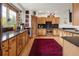 Well-lit kitchen with granite countertops, wooden cabinets, and stainless steel appliances at 1654 Muirfield Ln, Evergreen, CO 80439