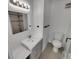 Modern bathroom with sleek vanity, updated fixtures, tiled shower, and neutral decor at 11422 W 17Th Pl, Lakewood, CO 80215
