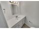 Modern bathroom featuring a new vanity, sink, and updated fixtures at 11422 W 17Th Pl, Lakewood, CO 80215