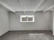 Cozy bedroom with exposed beam ceiling, new carpeting, and natural light at 11422 W 17Th Pl, Lakewood, CO 80215