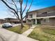 Well-maintained two-story condo with manicured lawn and mature trees, located in a quiet neighborhood at 11422 W 17Th Pl, Lakewood, CO 80215