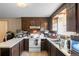 View of the kitchen, showing the sink, stove, and cabinets at 12573 W 8Th Ave, Golden, CO 80401