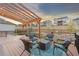 Deck with chairs under a wooden pergola and a view of the neighborhood at 18267 W 95Th Ave, Arvada, CO 80007