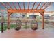 Deck with hanging basket chairs under a wooden pergola at 18267 W 95Th Ave, Arvada, CO 80007