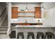 Finished basement bar with elegant cabinets, bar seating and sleek countertop at 18267 W 95Th Ave, Arvada, CO 80007