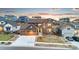 Beautiful two-story home with stone accents, a well-maintained lawn, and a two-car garage in a modern neighborhood at 18267 W 95Th Ave, Arvada, CO 80007