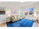 Bright living room with large windows, neutral tones, and a comfortable seating area at 18267 W 95Th Ave, Arvada, CO 80007