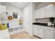 Well-organized mudroom with bench, storage, and access to the kitchen at 18267 W 95Th Ave, Arvada, CO 80007