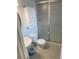 Bathroom featuring a tiled shower and mirrored vanity cabinet at 201 S Monmouth Ave, Firestone, CO 80520