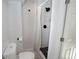 Bathroom including gray shower with tiled details at 201 S Monmouth Ave, Firestone, CO 80520