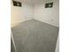 Bedroom with gray carpet and natural light from the egress window at 201 S Monmouth Ave, Firestone, CO 80520