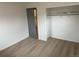 Neutral bedroom with plush carpet, closet with open door, and gray trim at 201 S Monmouth Ave, Firestone, CO 80520
