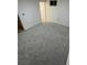 Bedroom with gray carpet and a small window at 201 S Monmouth Ave, Firestone, CO 80520