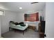 Simple bedroom with an American flag hanging on the wall at 201 S Monmouth Ave, Firestone, CO 80520