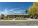 Charming single-story brick home with an attached two car garage and a well manicured lawn at 201 S Monmouth Ave, Firestone, CO 80520