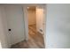 Hallway featuring wood-look flooring at 201 S Monmouth Ave, Firestone, CO 80520