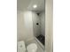 Bathroom featuring a shower with black and gray tile at 201 S Monmouth Ave, Firestone, CO 80520