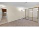 Finished basement with large closet, neutral walls and carpet at 14192 E Baltic Pl, Aurora, CO 80014