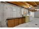 Utility room in unfinished basement with washer, dryer, and workbench at 14192 E Baltic Pl, Aurora, CO 80014