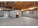 Unfinished basement area with exposed ceiling and concrete floor at 14192 E Baltic Pl, Aurora, CO 80014