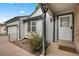 Charming front entrance with white trim and well-manicured landscaping at 14192 E Baltic Pl, Aurora, CO 80014