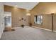 Spacious living room featuring high ceilings, statement lighting, and a charming window seat at 14192 E Baltic Pl, Aurora, CO 80014