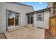 Open patio area with dual sliding glass doors for indoor/outdoor living and private outdoor space at 14192 E Baltic Pl, Aurora, CO 80014