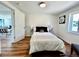 Bright bedroom featuring wood floors, a comfortable bed, and neutral walls that make it a relaxing retreat at 601 W Layton Ave, Englewood, CO 80110