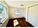 Bright bedroom featuring wood floors, natural light from multiple windows, and a closet at 601 W Layton Ave, Englewood, CO 80110