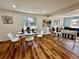 Dining area with modern decor, seamlessly flowing into living spaces with hardwood floors at 601 W Layton Ave, Englewood, CO 80110