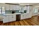 Modern kitchen with quartz countertops, stainless steel appliances, and ample cabinet space at 601 W Layton Ave, Englewood, CO 80110