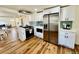 Well-appointed kitchen with stainless steel appliances, white cabinetry, and open-concept design at 601 W Layton Ave, Englewood, CO 80110