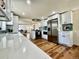Bright kitchen featuring stainless steel appliances, white cabinets, and an open layout at 601 W Layton Ave, Englewood, CO 80110