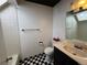 Bathroom with checkered floor, white tile, and a vanity at 12484 W Nevada Pl # 210, Lakewood, CO 80228