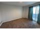 Bright bedroom with carpet flooring and access to a balcony at 12484 W Nevada Pl # 210, Lakewood, CO 80228