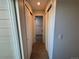 Hallway with carpet flooring and access to the bathroom at 12484 W Nevada Pl # 210, Lakewood, CO 80228