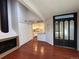 Living room with hardwood floors, a fireplace, and a view into the kitchen at 12484 W Nevada Pl # 210, Lakewood, CO 80228