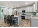 Spacious kitchen with modern appliances, a center island, and stylish pendant lighting at 1262 High Point Trl, Elizabeth, CO 80107