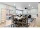 Cozy living space, seamlessly connected to the dining area, with sliding glass doors to backyard at 1262 High Point Trl, Elizabeth, CO 80107