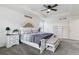 A spacious main bedroom features a tray ceiling, plush carpet, and ample closet space at 1262 High Point Trl, Elizabeth, CO 80107